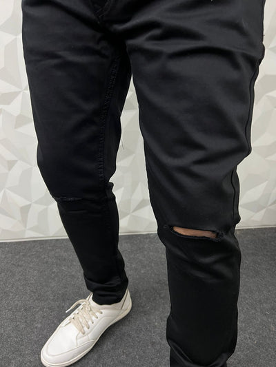 Ankle length black knee cut jeans